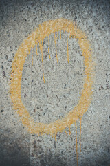 Yellow numbers on a concrete wall, number 0