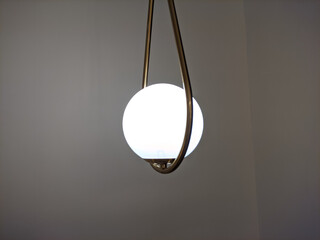 hanging round indoor lamp with a unique and antique design