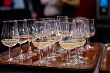 Many small tasting glasses of sparkling wine champagne on winter festival in December, Avenue de Champagne, Epernay, Champagne region, France