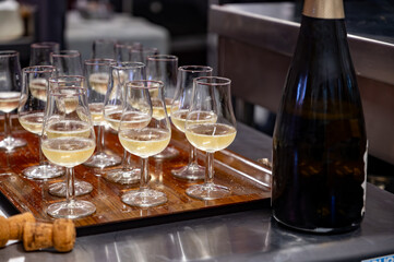 Many small tasting glasses of sparkling wine champagne on winter festival in December, Avenue de Champagne, Epernay, Champagne region, France