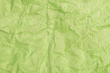  A Close-Up Shot of a Crumpled Green Paper