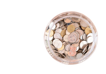 top view of Thai coins in transparent plastic jar isolated on white background in png file format. Concept of saving money for the future or money growth