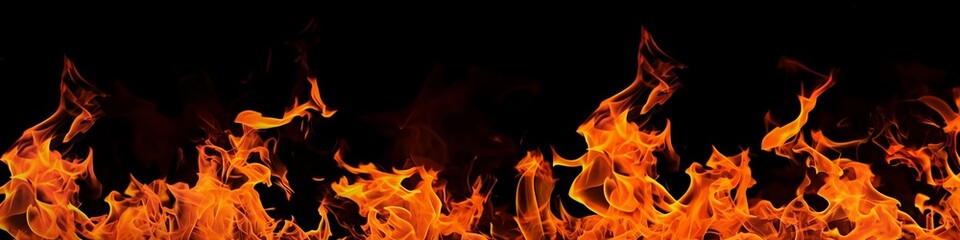 Fototapeta premium Flames of fire blazing on black background.