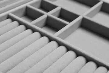 Empty light grey jewelry box as background, closeup