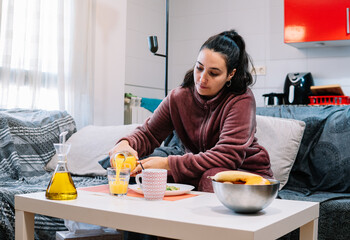 Woman serving orange juice