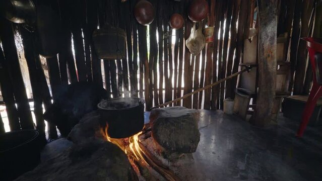 Pot boiling in mayan hut in Mexico