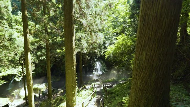 Cinematic gimbal shot of misty Mototaki Fukuryusui Underflow waterfalls in Akita prefecture in Japan