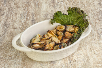 Tasty marinated mussels in the bowl