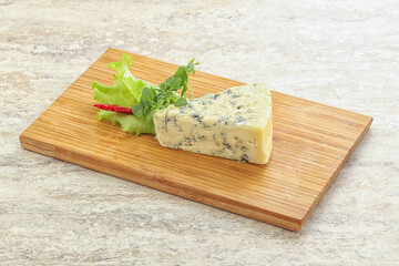 Blue cheese piece over board