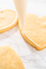 Heart-shaped sugar cookies with royal icing