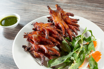 A closeup view of a Vietnamese chicken feet entree called chan ga nuong.