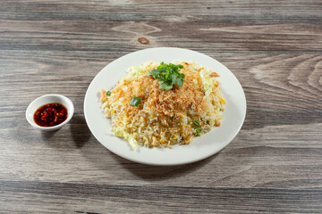 A view of an entree of salted fish fried rice.