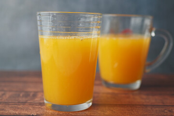glass of orange juice on table 