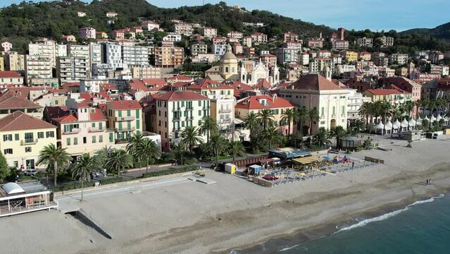 Aerial flyover above the beautiful village of Finale Ligure in northern Italy on the Mediterranean Sea