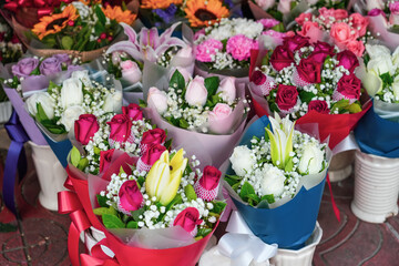 Many lot bouquets compositions of flowers of various colored yellow red pink and white shades of...