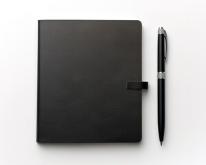 A black notebook with a pen beside it