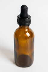Drops in tea-colored medicine bottles are used in scientific and medical experiments.