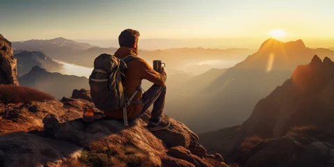 Fotobehang Young man drinking coffee on the top of mountain. © PRASANNAPIX