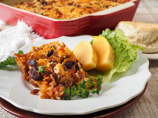 Spicy Rice and Bean Casserole Serving with Melon and Biscuit Horizontal