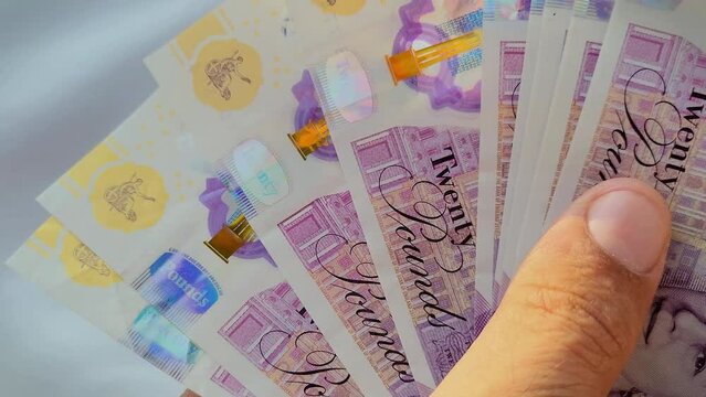 Hand with euro banknotes