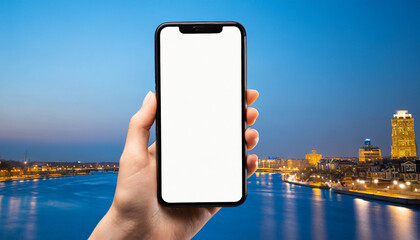 Person with blank screen smartphone on city background.