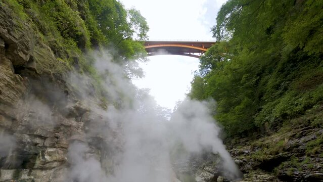 Cinematic gimbal shot of steam vents at Oyasukyo Gorge in Akita prefecture in Japan