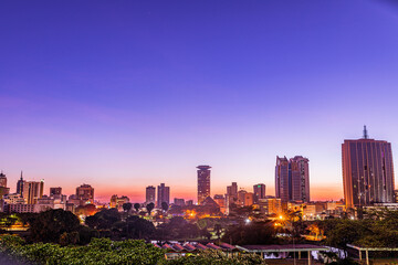 Fototapeta na wymiar Nairobi City County Kenya's Capital Sunset Sunrise Sundowner Golden Hour Cityscapes Skyline Skyscrapers Landscapes Tall Building Landmarks In Kenya East Africa Aerial Tower High-rise Modern City House