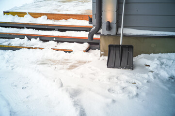 snow removal from steps of the veranda outside the house