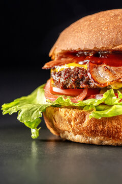 Delicious burger beef and bacon , sandwich, fast food, delicious food, close up on black background