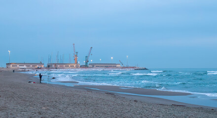 view of Marina di Carrara harbour from Marinella in tuscany