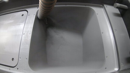 Pouring metal powder into working surface of 3D printer for metal. Flowing Metal Powder inside 3d...