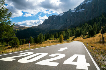 2024 New Year road trip travel and future vision concept . Nature landscape with highway road...