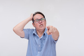 A livid and vengeful man issuing a threatening warning. Seething with extreme anger. Isolated on a...