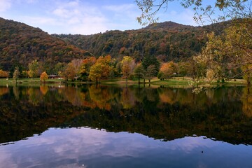Autumn view of Ghirla lake in province of Varese, north Italy