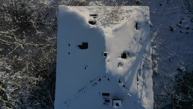 winter landscape with the ruined construction of family house. tree torso shelling and returning to snow covered damaged looted dwelling. how are we going to survive, returnee, ruined
winter operator