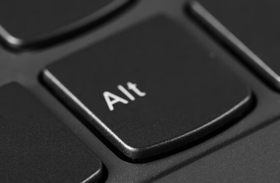 Alt option symbol keyboard key button, lap top background and texture, side view