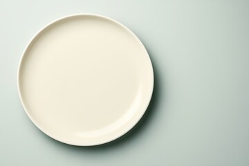 White plate on a light background. Top view.