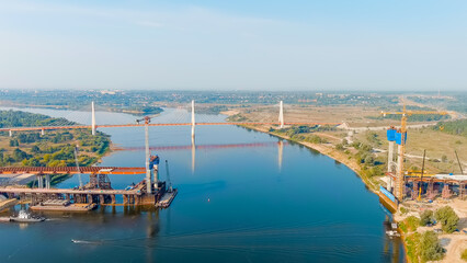 Naklejka na ściany i meble Murom, Russia. Construction of a bridge across the Oka River. Highway M-12 Moscow-Nizhny-Novgorod-Kazan, Aerial View