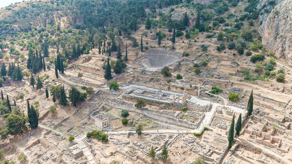 Fototapeta na wymiar Delphi, Greece. Ruins of the ancient city of Delphi. Sunny weather, Summer, Aerial View