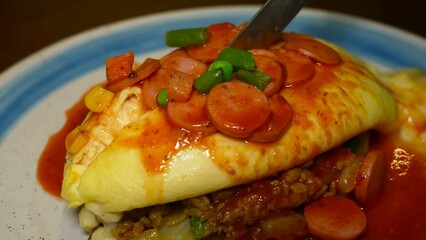 Process of cutting an omelette roll placed on risotto, pouring sauce over the dish, and adding various tasty ingredients
