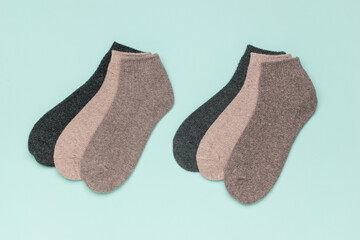 A set of colorful socks on a light blue background.
