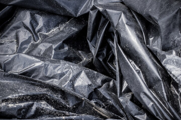 Black plastic garbage bag, black polyethylene texture