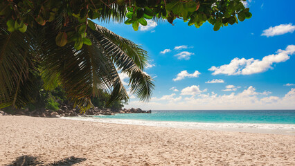 Palm and tropical beach panorama. Anse Lazio beach at Praslin island, Seychelles, long exposure, vintage toning