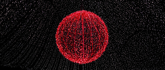 Sphere made of red leds on a black background with whie leds