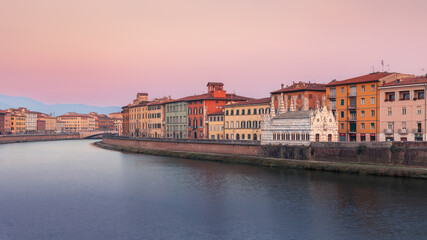 Arno river embankment with Chiesa di Santa Maria della Spina gothic church at sunset, Pisa, Italy