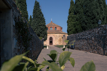 San Michele Arcangelo small round ancient christian temple with cypress trees at day, Perugia, Italy