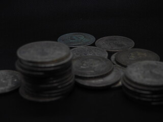 Five peseta coins, silver coins of Alfonso XIII on a black background