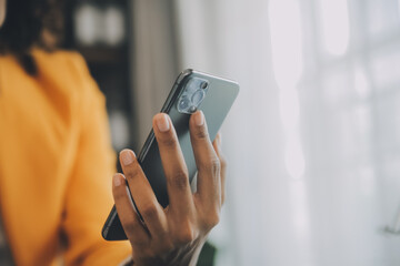 Creative Asian young woman working on laptop in her studio