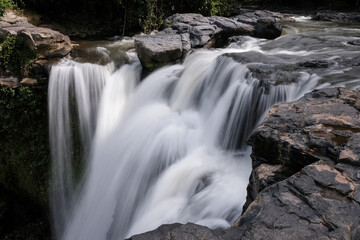 Long exposure shot of upper part of Tegenungan waterfall. Bali, Indonesia.