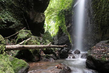 Long exposure shot of the smallest of Krisik waterfalls. Bali, Indonesia.